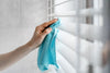 Microfiber cloth wiping a window blind